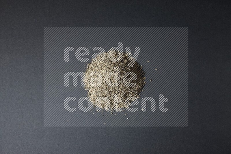 حبوب الكمون علي خلفية سوداء