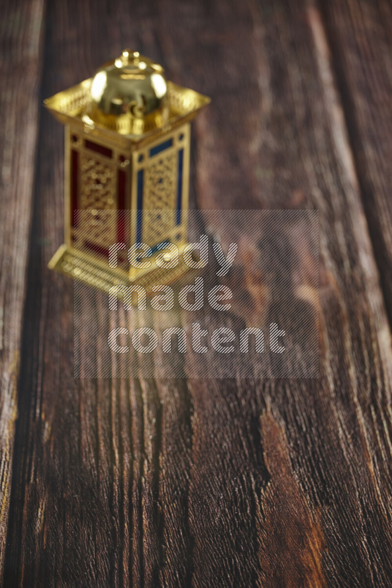 A lantern placed on a wooden background