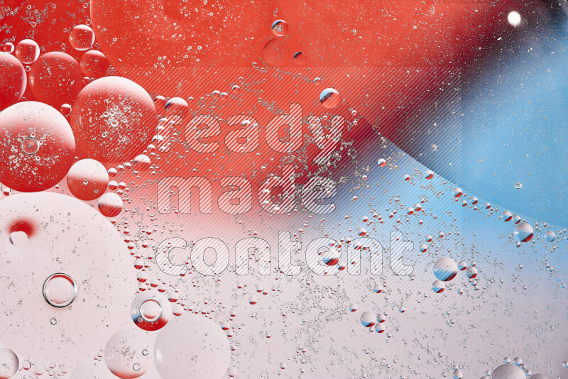 Close-ups of abstract oil bubbles on water surface in shades of red, white and blue