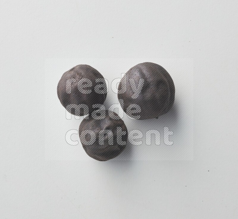 Top-view shot of dried lime (loomi) on white background