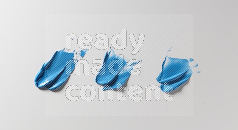 Blue painting knife strokes on white background