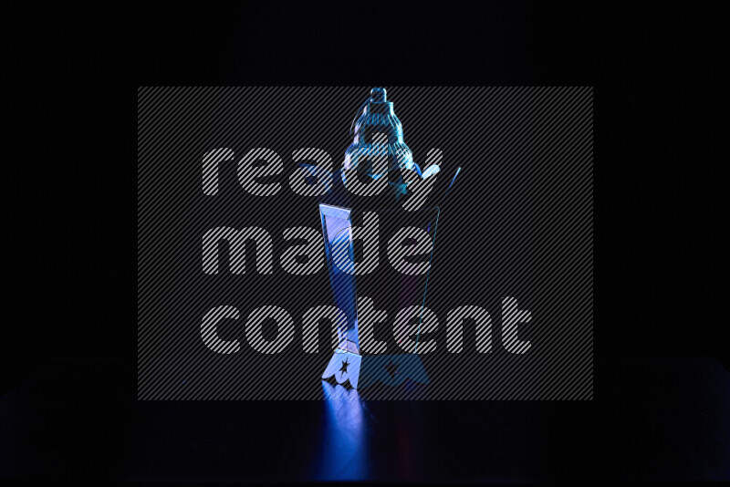 Ramadan lanterns with colored rim light against black background