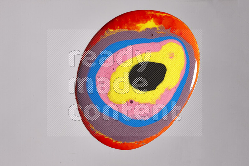 Close-ups of assorted colors blending on a grey background