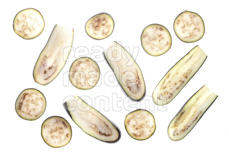 Eggplant slices on illuminated white background