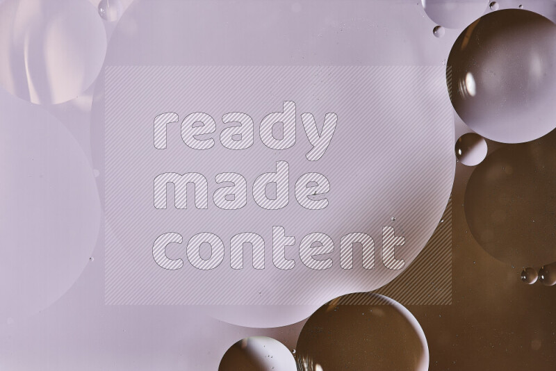 Close-ups of abstract oil bubbles on water surface in shades of white and brown