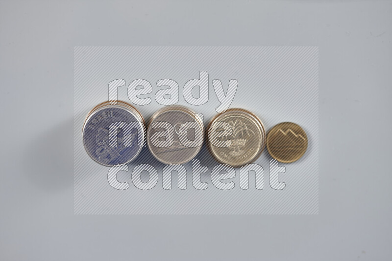 Random old coins on grey background