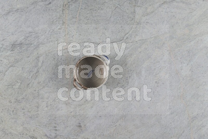 A multicolored pottery Bowl on grey marble background