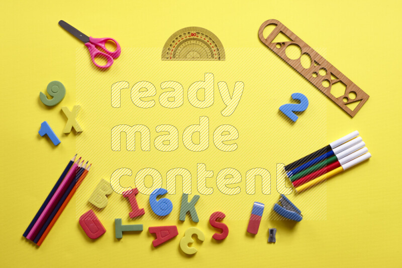 Different school supplies on yellow background