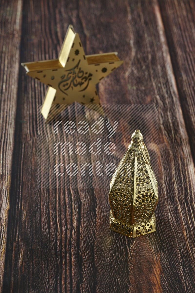 A star lantern with classic lantern on brown wooden background