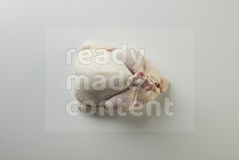 Whole fresh chicken direct on a white background