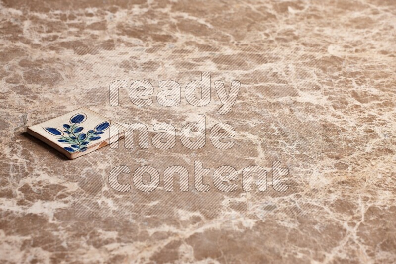 A decorative coaster on beige marble background