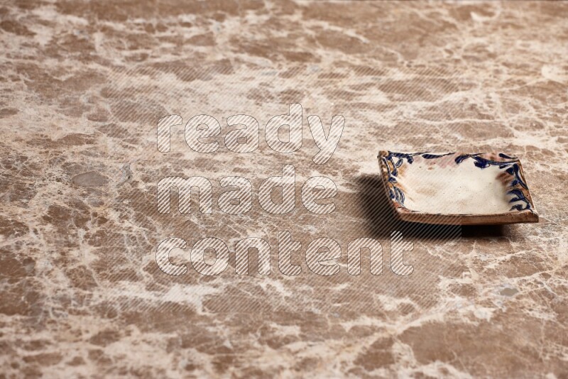 Decorative Pottery Plate on Beige Marble Flooring