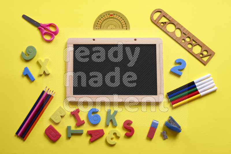 A blackboard with different school supplies on yellow background