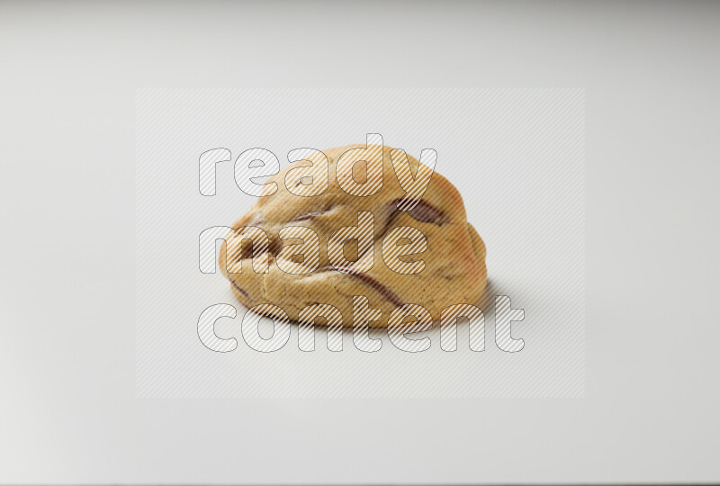 a chocolate chip cookie on a white background