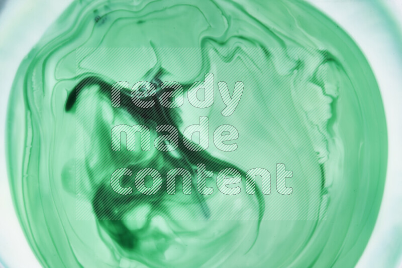 A close-up of abstract swirling patterns in green gradients