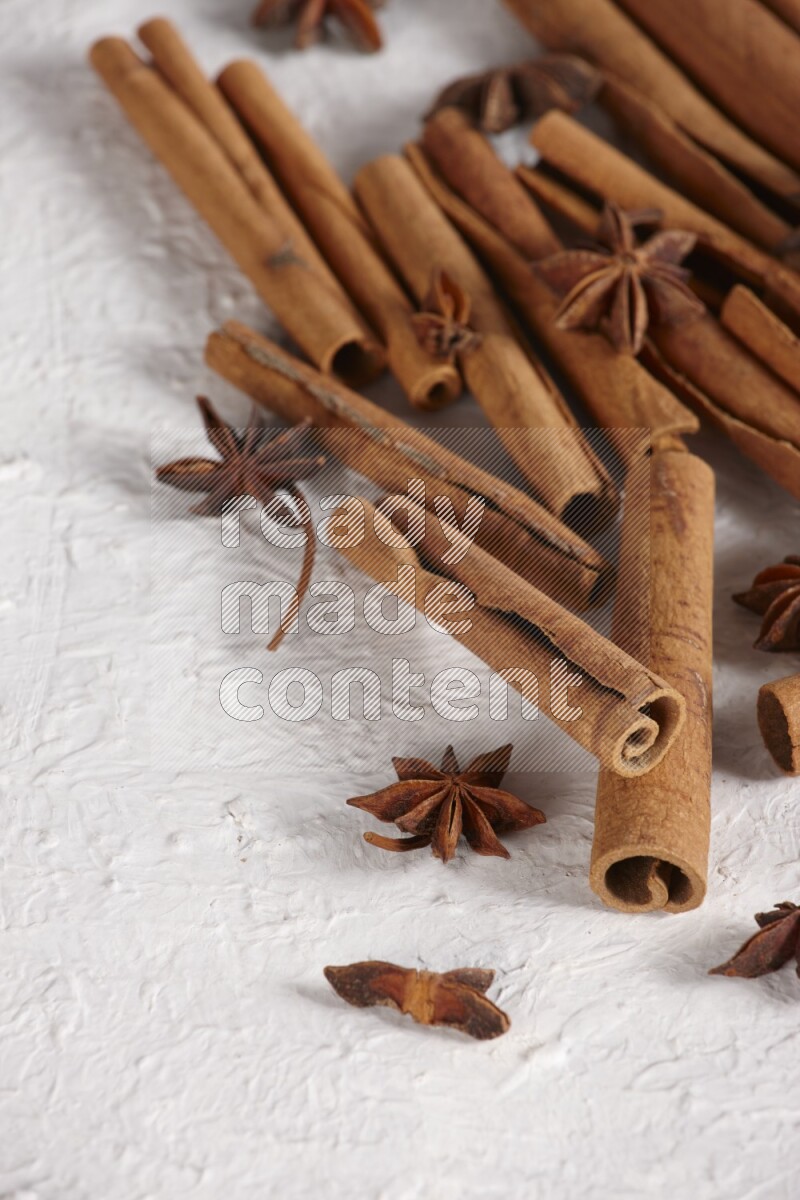 cinnamon sticks with star anise on white background