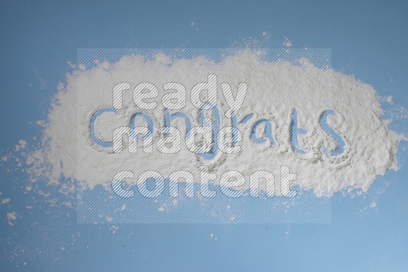 A word written with powder on blue background