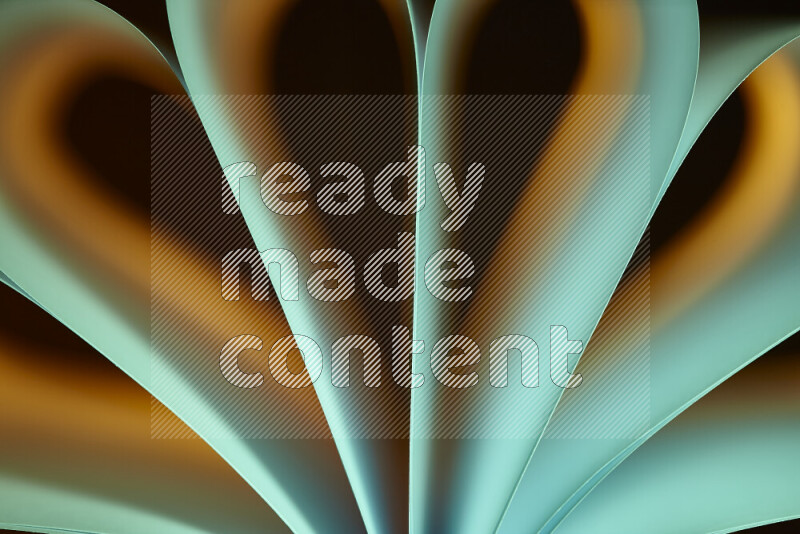 An abstract art piece displaying smooth curves in yellow and green gradients created by colored light