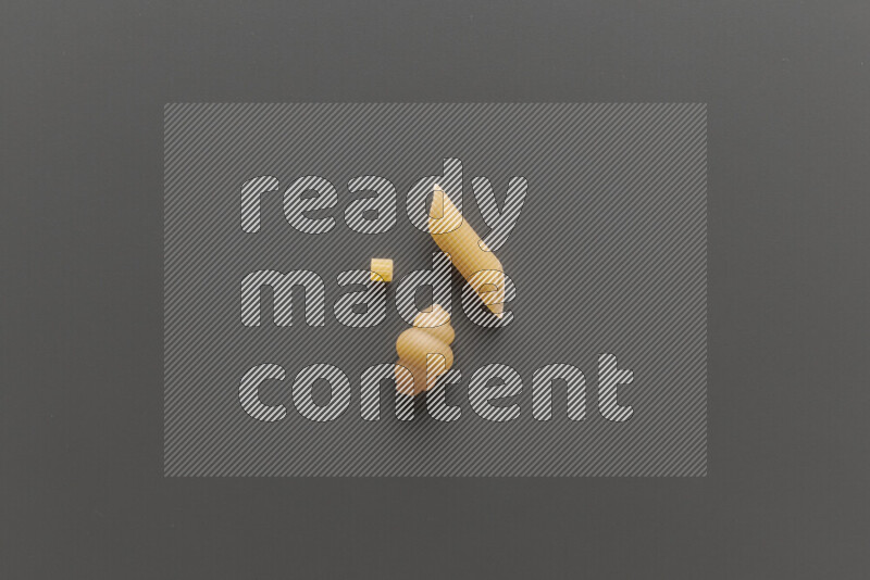 Different pasta types on grey background