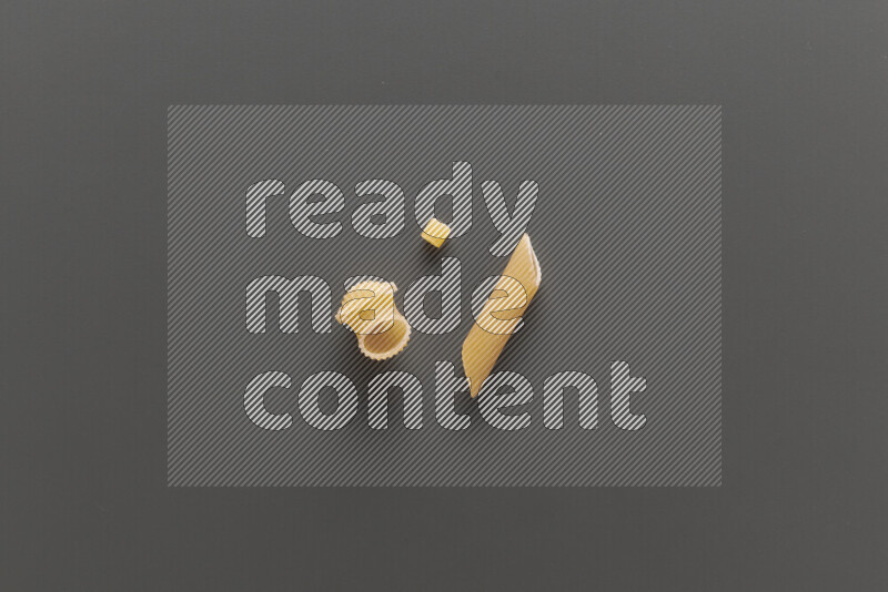 Different pasta types on grey background