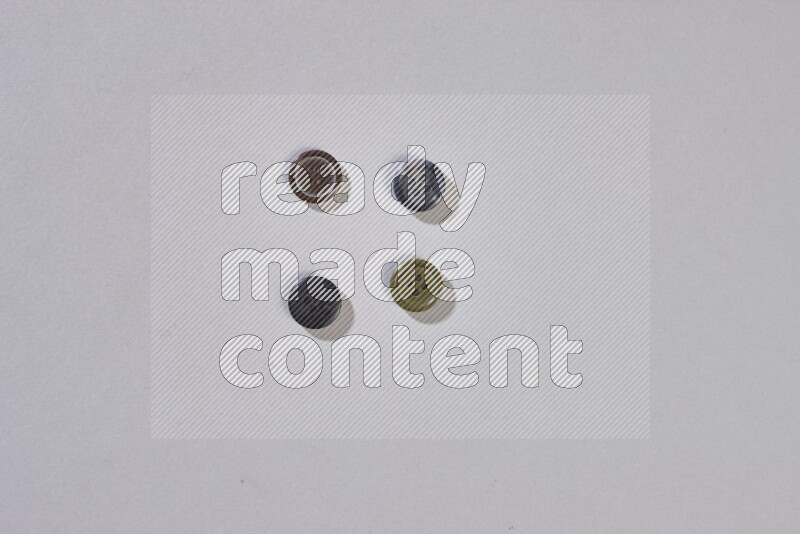 Mixed assorted buttons on grey background