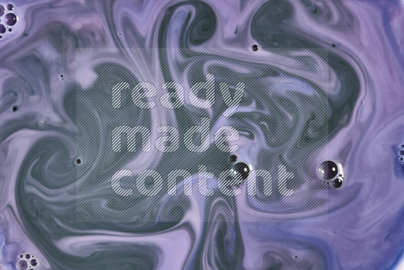 A close-up of abstract swirling patterns in blue, pink and green