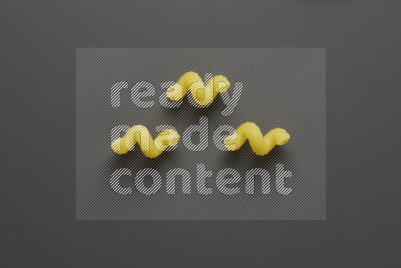Twist pasta on grey background