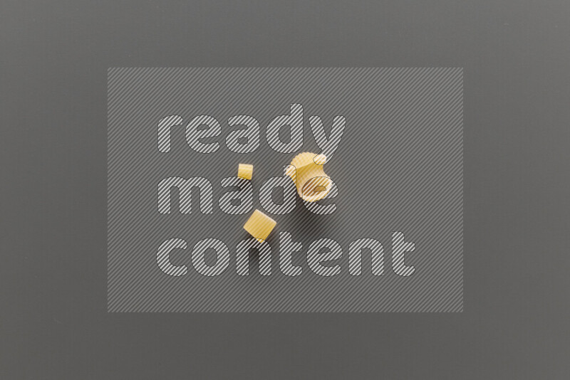 Different pasta types on grey background