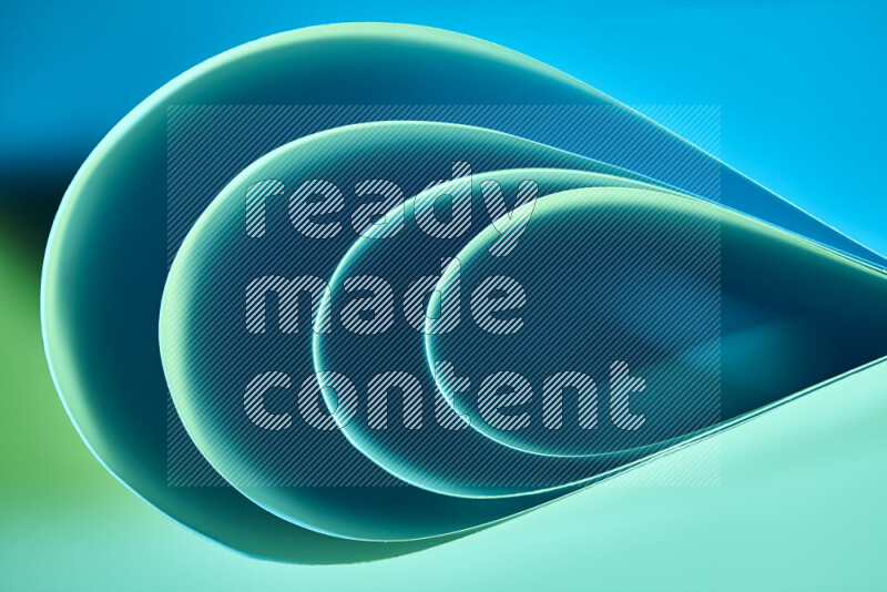 An abstract art of paper folded into smooth curves in green and blue gradients