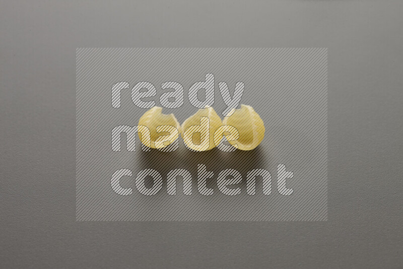 Shells pasta on grey background