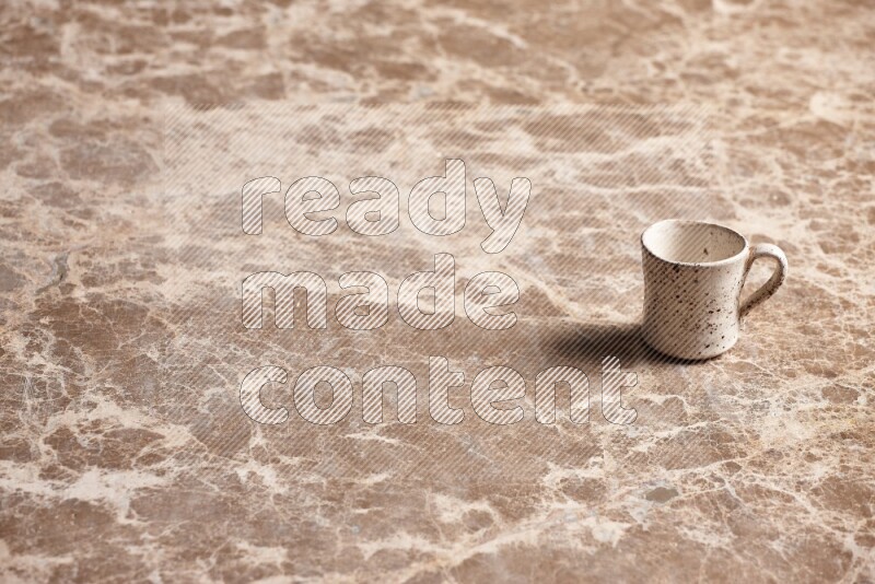 Pottery Cup on Beige Marble Flooring