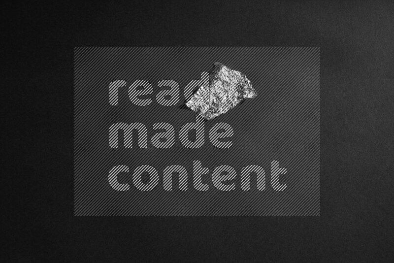 Aluminium foil on black background
