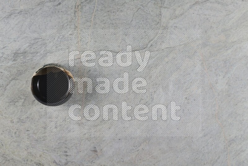 A multicolored pottery Bowl on grey marble background