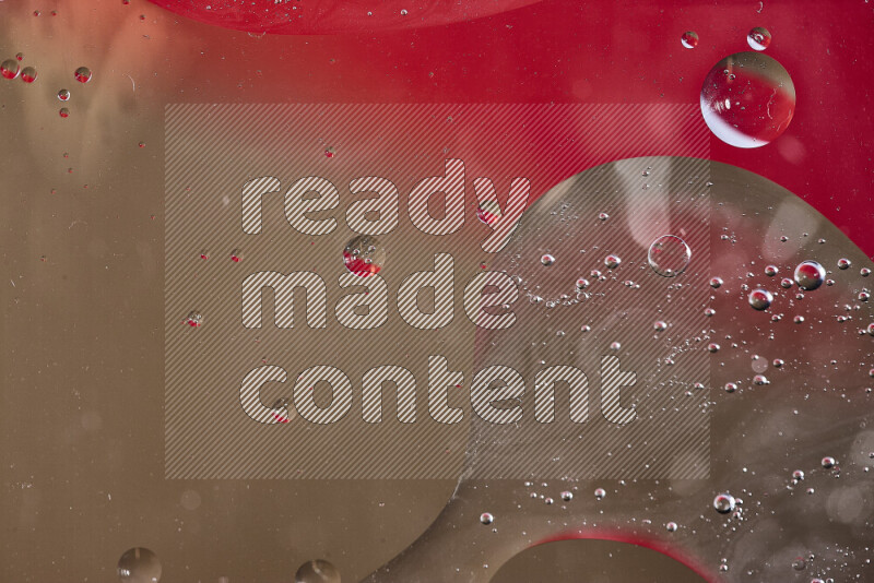 Close-ups of abstract oil bubbles on water surface in shades of red and brown