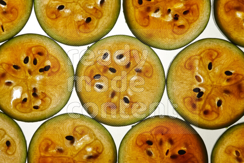 Watermelon slices on illuminated white background