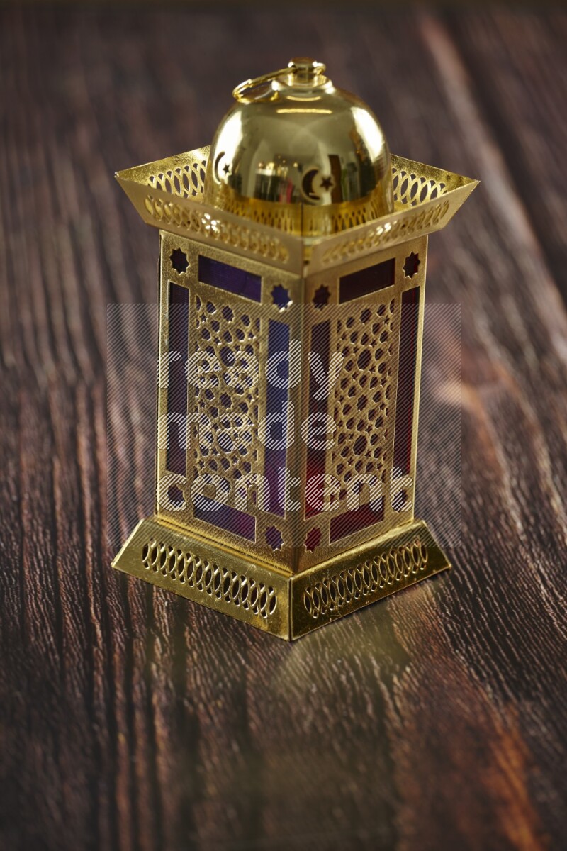 A lantern placed on a wooden background