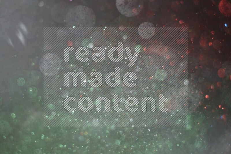 Multicolored glitter powder isolated on black background