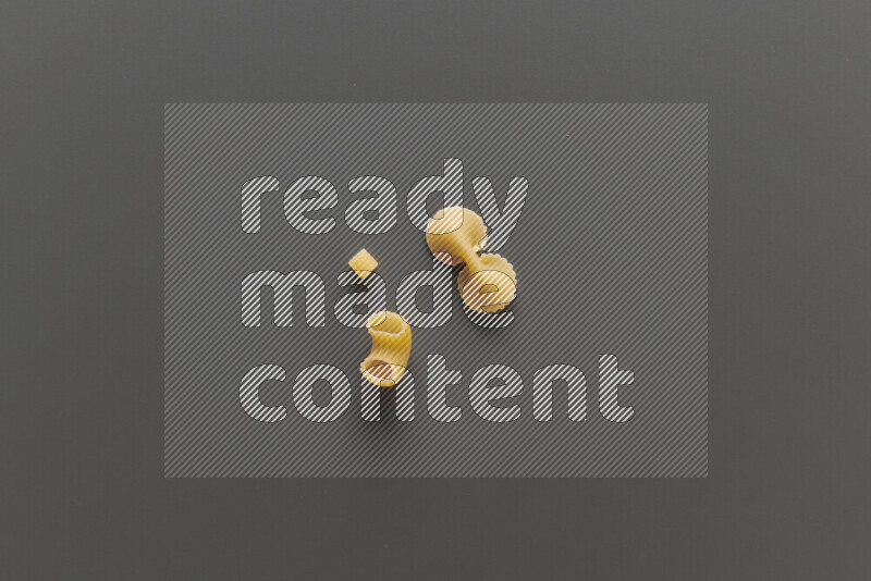 Different pasta types on grey background