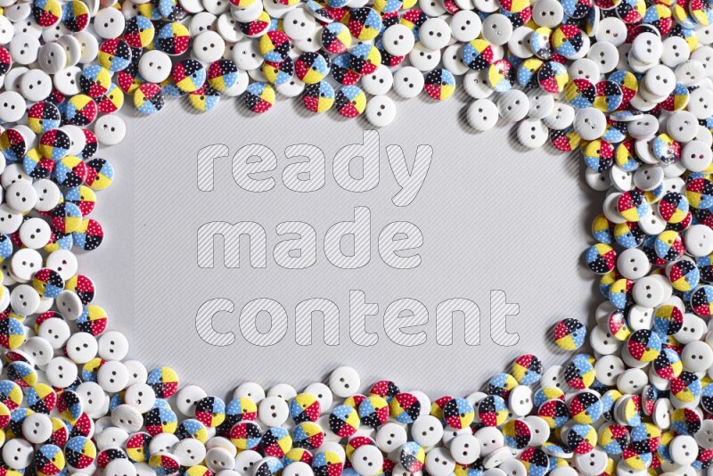 Multicolored buttons placed on grey background