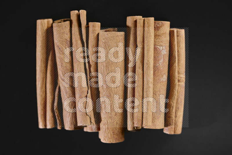 Cinnamon sticks on black background