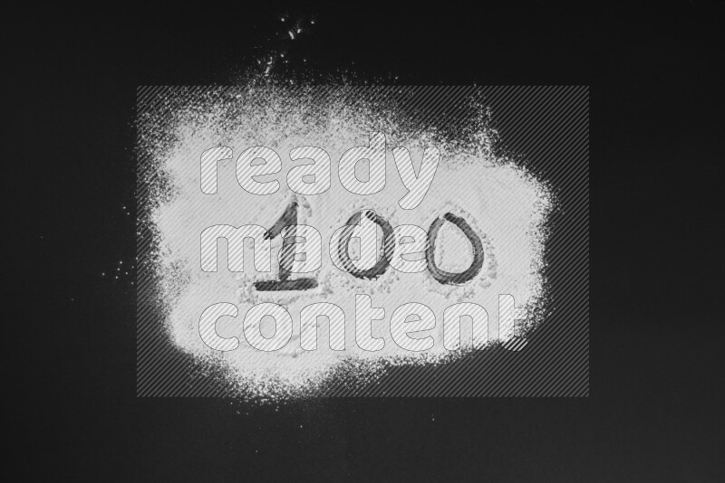Numbers written with powder on black background