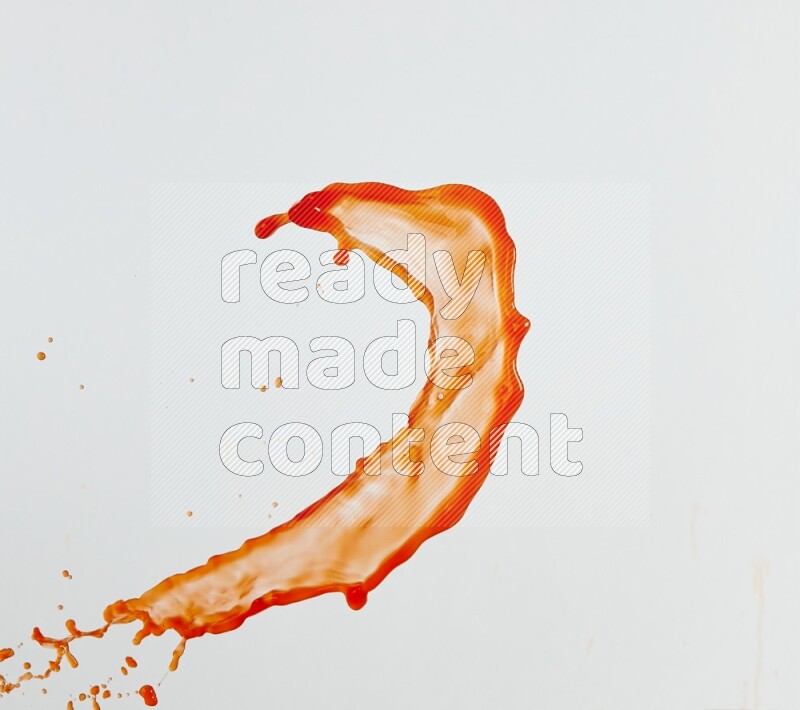 Orange liquid splash and drops on white background