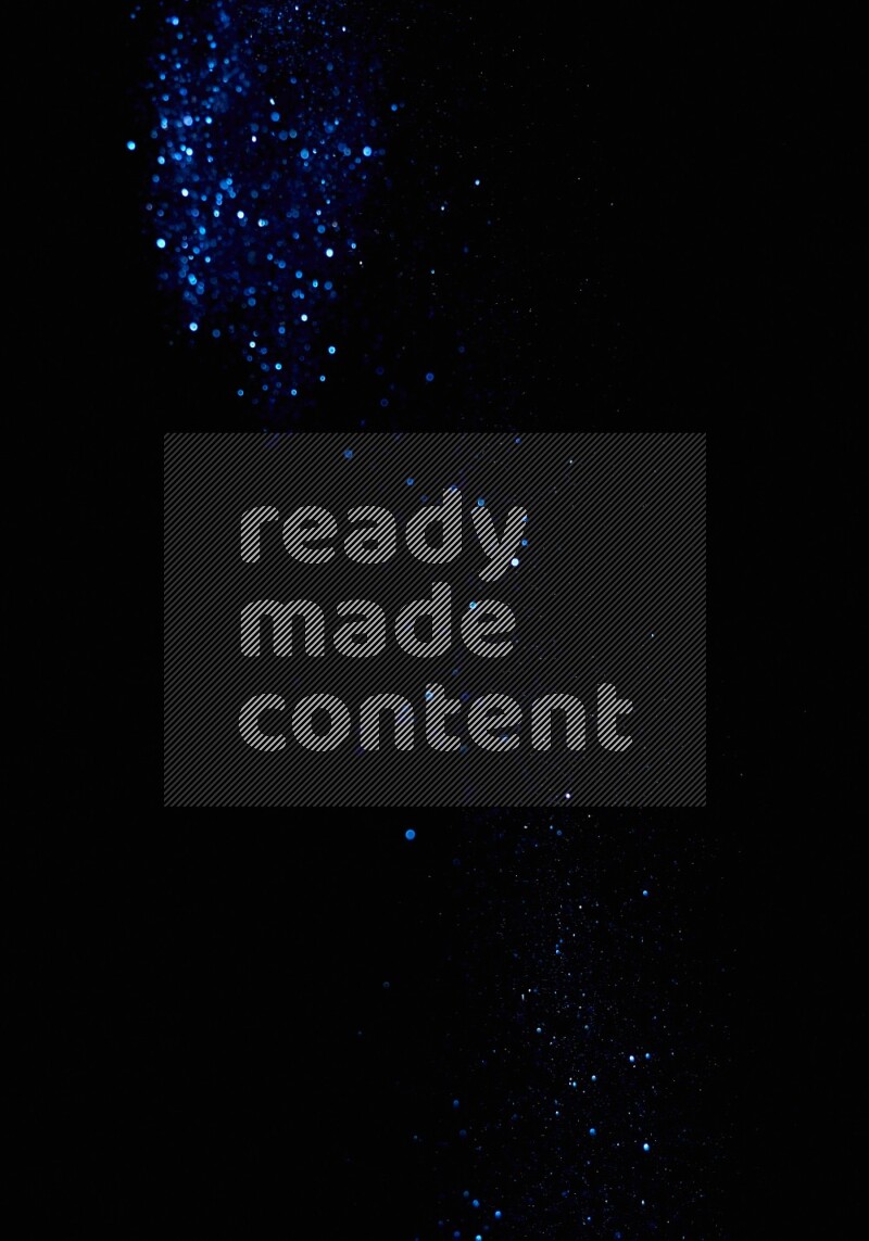 Blue glitter powder isolated on black background