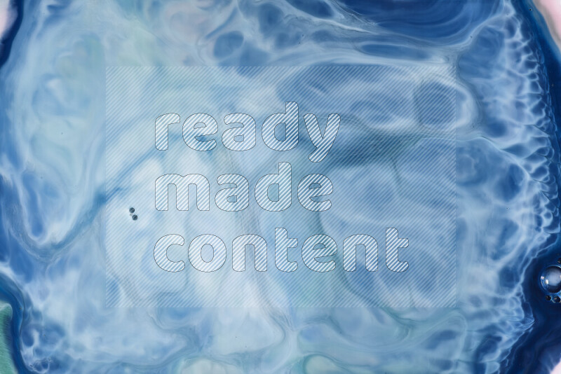 A close-up of abstract swirling patterns in blue and white