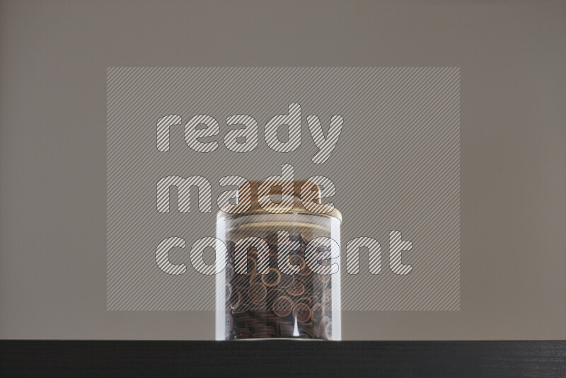 Buttons in a glass jar on black background