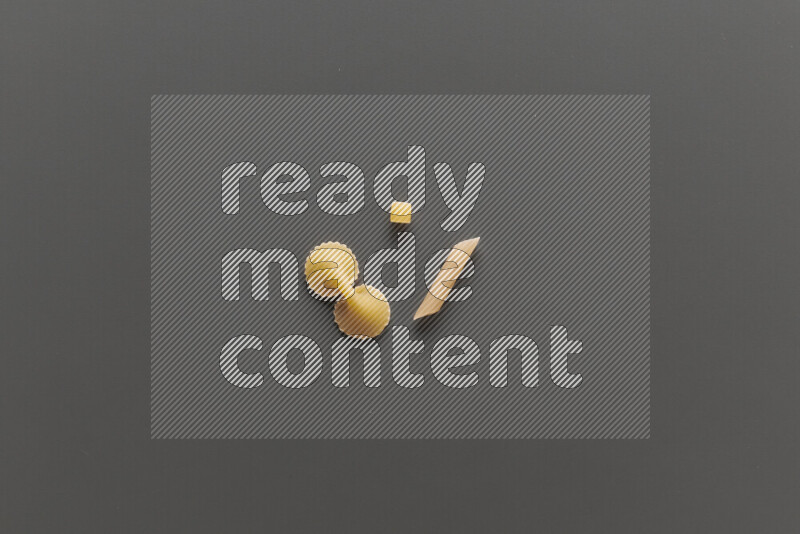 Different pasta types on grey background