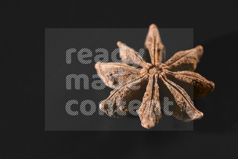 Star anise on black background