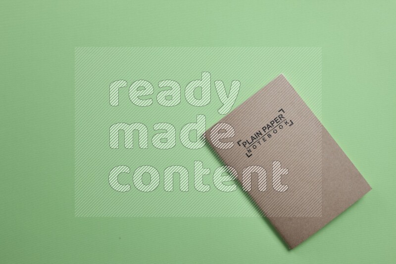 A notebook on green background