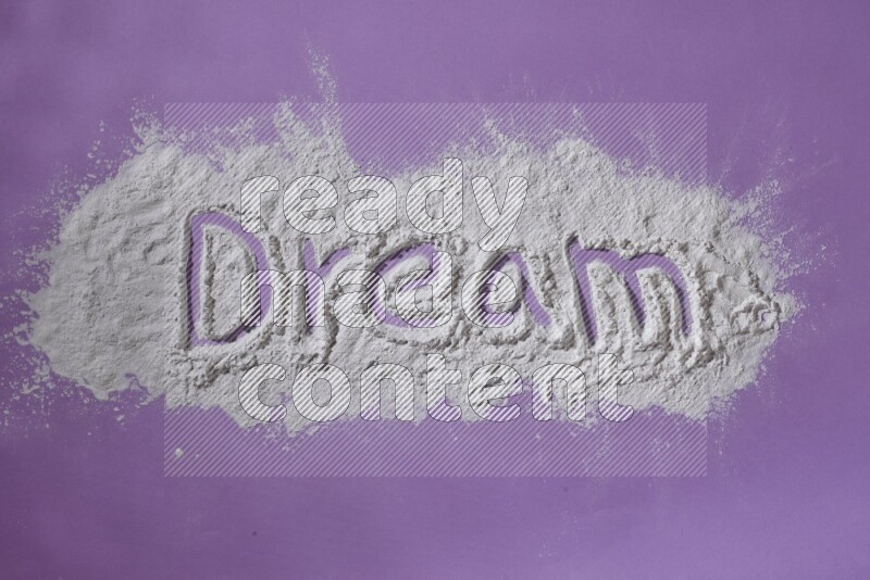A word written with powder on purple background