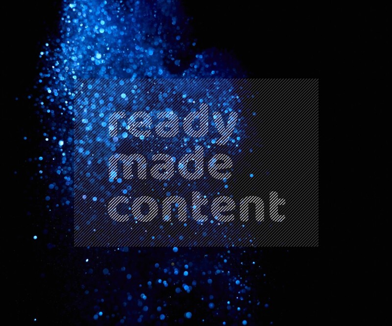 Blue glitter powder isolated on black background